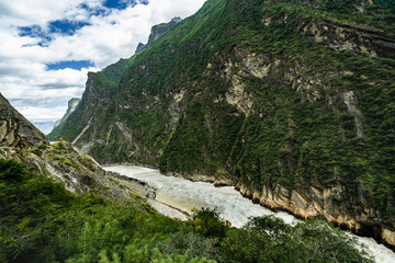 Fototapeta na wymiar Panoramic top view of the Jade Dragon Snow Mountain on the hiking trails of the Tiger Leaping Gorge, Lijiang Yunnan, China