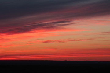 Fototapeta na wymiar cirrus red clouds during sunset