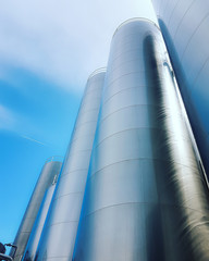 Madrid, Spain 06/14/2019: large aluminum storage tanks of a modern factory