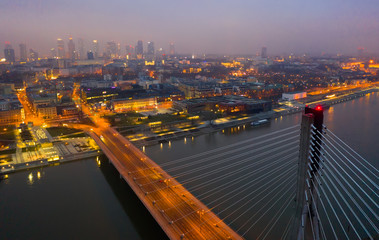 Fototapeta premium Warsaw with Swietokrzyski Bridge at twilight