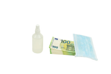 Purchase of personal protective equipment blue medical mask and antiseptic in a white bottle with a sprayer for Euro banknotes 100 one hundred euros. Isolated white 