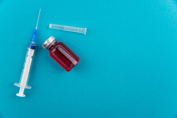 Medicine bottle for injection. Medical glass vials and syringe for vaccination. Drug or vaccine for...