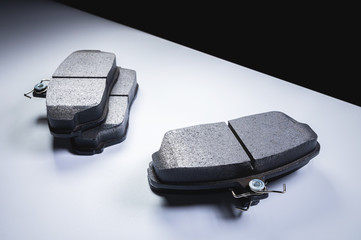 New car spare parts Brake pad set on a gray background