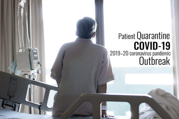Hospital quarantine or isolation of asian patient sitting alone bed with hopeful for treatment Coronavirus COVID-19 Pandemic with IV, Outbreak Efforts prevent virus spreading hazard controls concept