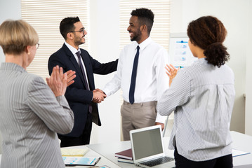 Fototapeta premium Business people congratulate their colleague of the success on the business seminar.