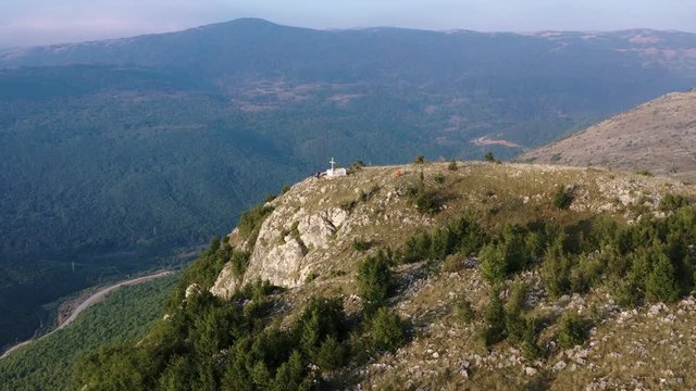 Aerial Over Krizevac Cross Mountain In Bosnia And Herzegovina With Forested Hills In The Background