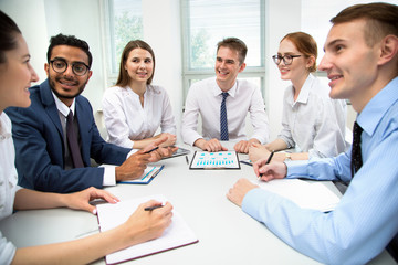Fototapeta premium Multy-ethnic group of young business people working with computer at office