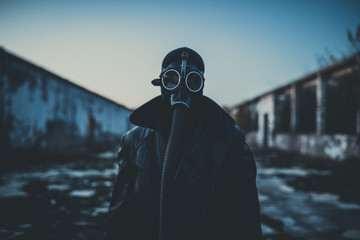 Man wearing protective gas mask. - 334148243