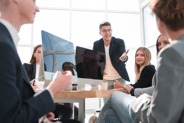 Manager at a meeting with the business team.