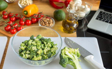 Healthy kitchen flat lay of fresh broccoli and other vegetables