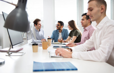 Multy-ethnic group of students study in a computer class