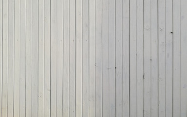 Background of vertical wooden boards in light beige color