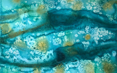 Abstract watercolor background of turquoise color with white salt stains and yellow flecks