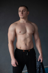 Fototapeta na wymiar handsome muscular man posing in studio