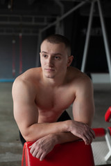 Fototapeta na wymiar young man exercising in gym