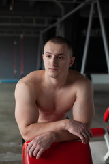 Fototapeta na wymiar young man exercising in gym
