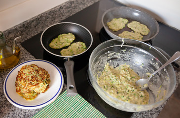 Process of cooked tasty zucchini pancakes  in frying pan