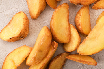 potatoes fried in oil on a gray background
