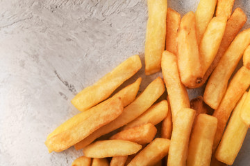 potatoes fried in oil on a gray background