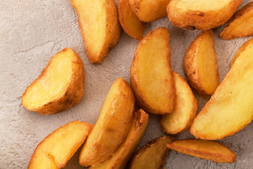 potatoes fried in oil on a gray background