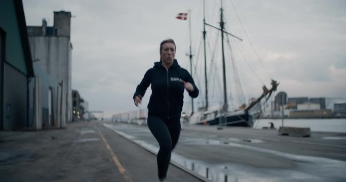 Athlete Running Along Path At Docks