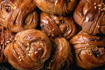 Close up of traditional Swedish cinnamon sweet buns Kanelbulle. Food background