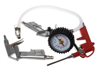 Compressed air brush hand guns one of which has a manometer and hose, isolated on white background