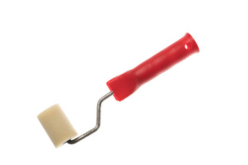Small clean paint roller with red handle, isolated on white background