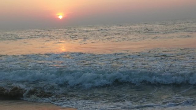 4K Sunrise over tropical island beach and palm trees. Phuket beach sea, View of beach sea on sun light in the summer. Colorful sunset over the beach in the tropical beach sea,the tropical paradise bea