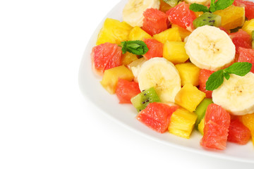 Bowl of healthy citrus fruit salad isolated on white background. Top view.