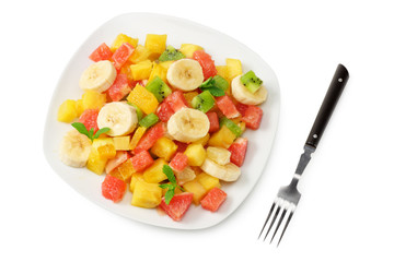 Bowl of healthy citrus fruit salad isolated on white background. Top view.