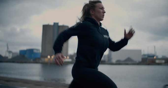 Fast Young Athlete In Ponytail Running