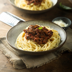 Homemade traditional pasta Bolognese with minced meat and tomato sauce