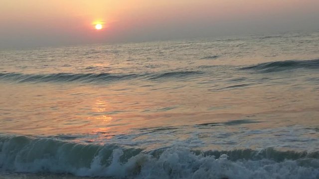 4K Sunrise over tropical island beach and palm trees. Phuket beach sea, View of beach sea on sun light in the summer. Colorful sunset over the beach in the tropical beach sea,the tropical paradise bea