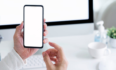 man hand holding smartphone with blank screen.