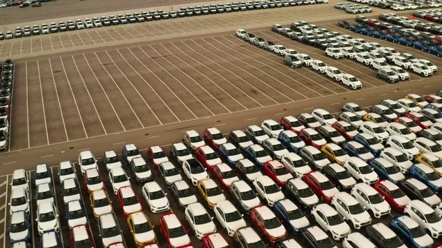 large parking lot of new cars from car factory in slovakia , kia 