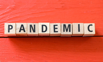 PANDEMIC. Word arranged from wooden letters Pandemic.