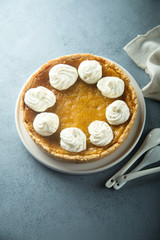 Homemade pumpkin pie with whipped cream