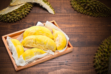 Durian the King of fruits, Durian fruit  on wooden background.durian fruit with delicious golden yellow soft flesh