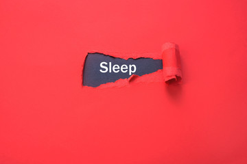 Torn red paper with a black background and a word sleep. Trend of ragged paper. Concept