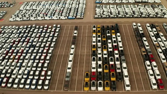 large parking lot of new cars from car factory in slovakia , kia 