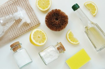 Eco friendly home cleaning products background, flat lay composition with vinegar, salt, lemon,...
