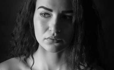 Black and white portrait of a beautiful young woman.