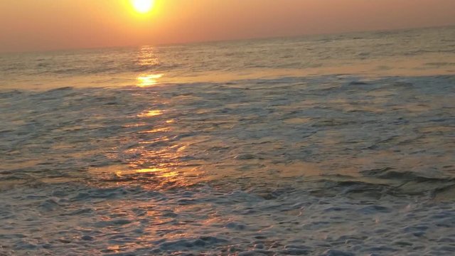 4K Sunrise over tropical island beach and palm trees. Phuket beach sea, View of beach sea on sun light in the summer. Colorful sunset over the beach in the tropical beach sea,the tropical paradise bea