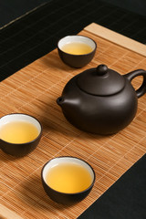 Teapot with purple sand teacup