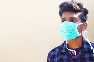 Awareness concept. Young Man wearing facial hygienic mask against the corona virus covid 19. Virus protection,Ecology, Air pollution,