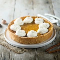 Homemade pumpkin pie with whipped cream