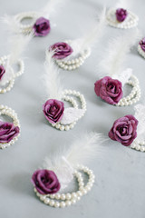 Obraz na płótnie Canvas Purple rose and feather. Bridesmaid bracelet.