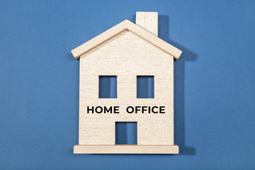 Home Office concept. Wooden house icon isolated on blue background