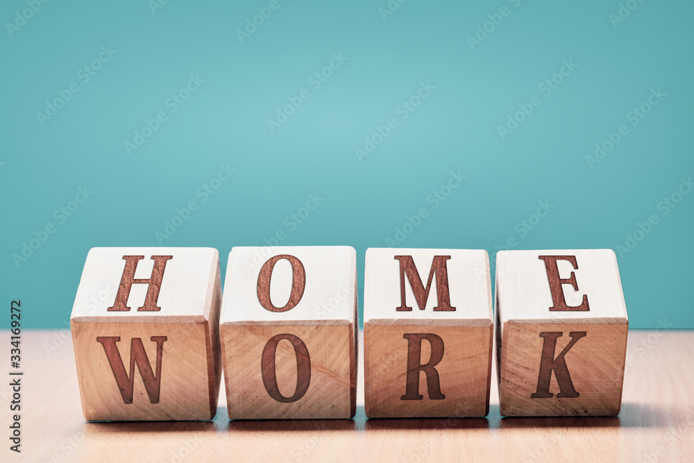 Fototapete wooden cubes with the words home and work with copy space: the concept of home work and work at home